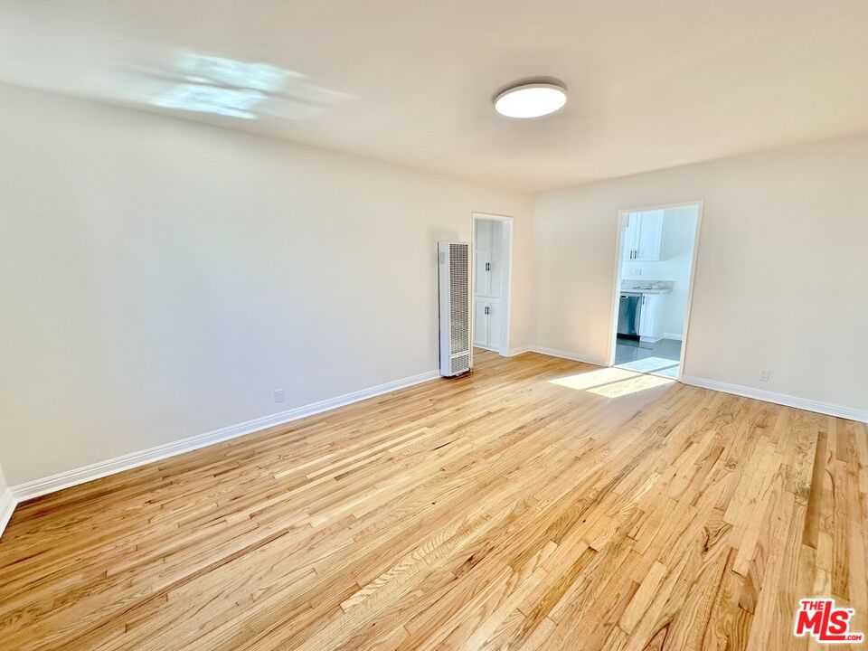 10720 Charnock Road Los Angeles, CA 90034 - Photo 21 of 33 a view of empty room with wooden floor