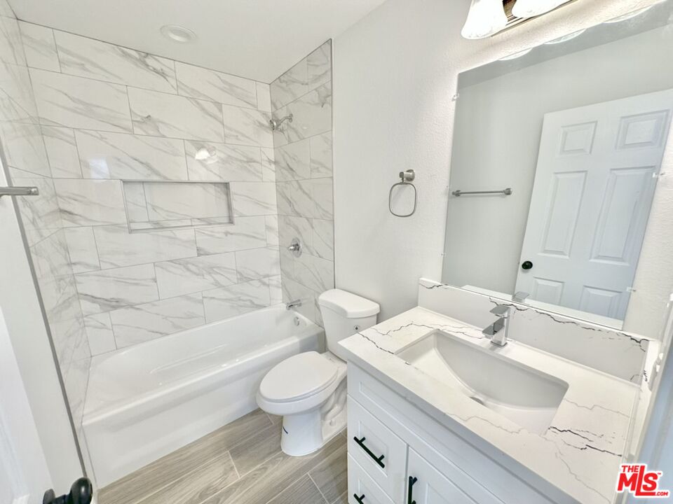 10720 Charnock Road Los Angeles, CA 90034 - Photo 32 of 33 a bathroom with a sink toilet and shower