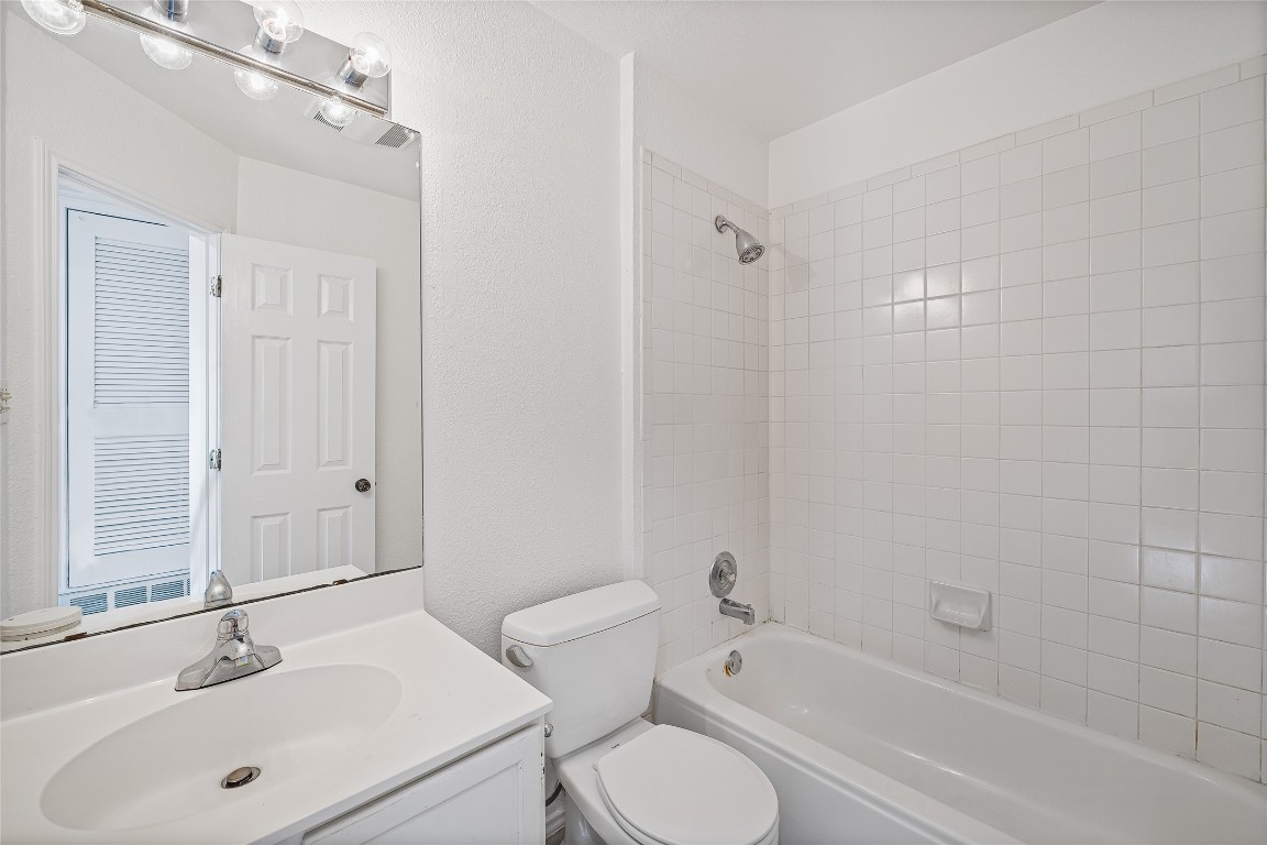 3007 Steck Avenue Austin, TX 78757 - Photo 12 of 15 a bathroom with a sink toilet and shower