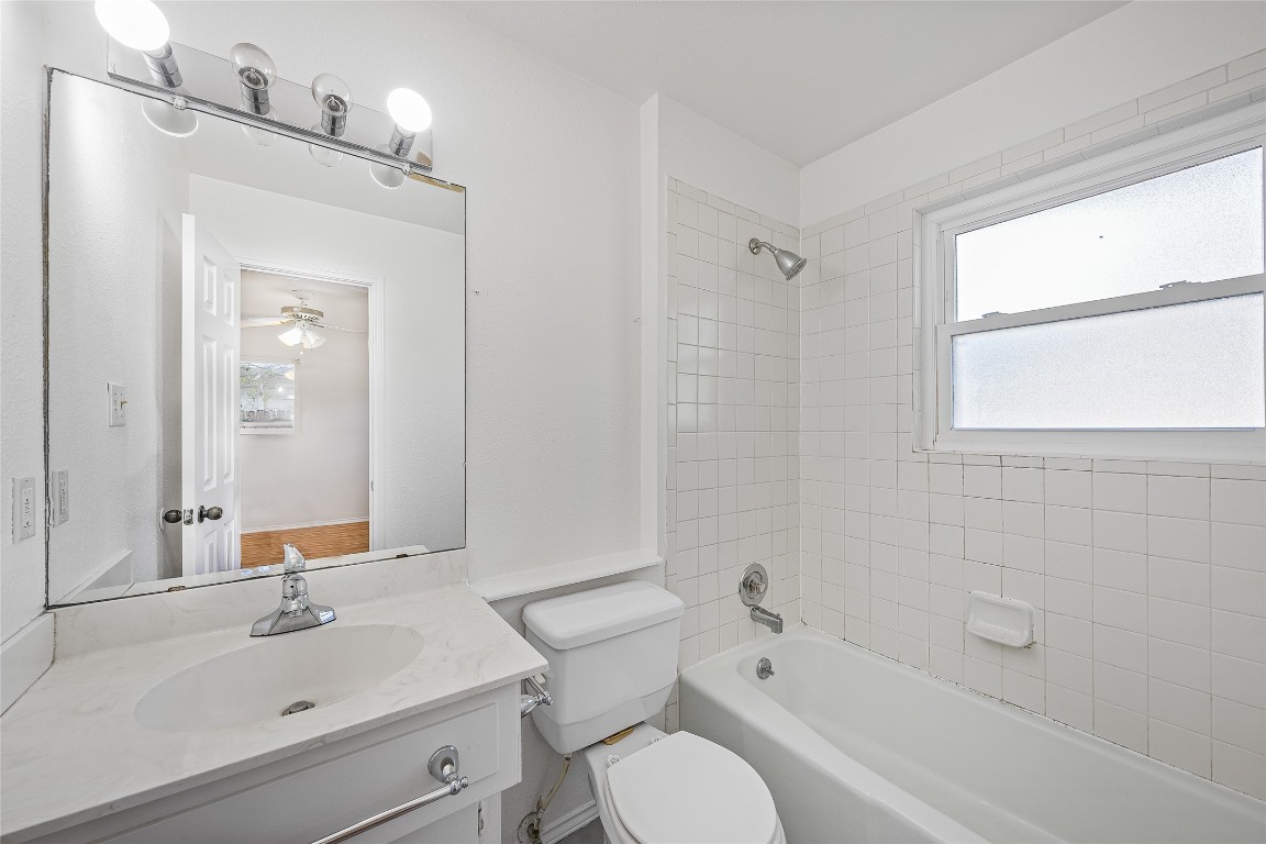3007 Steck Avenue Austin, TX 78757 - Photo 15 of 15 a bathroom with a sink toilet tub and shower