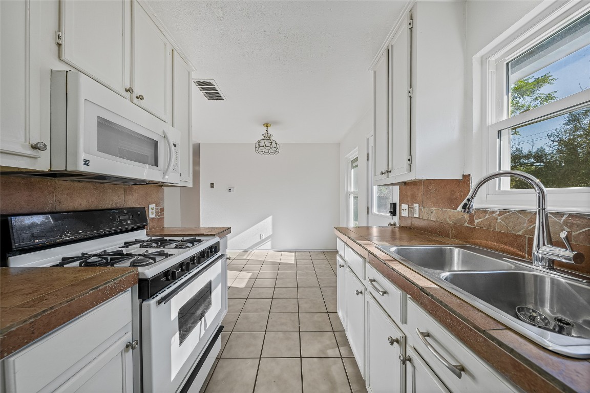 3007 Steck Avenue Austin, TX 78757 - Photo 2 of 15 a kitchen that has a sink and a stove