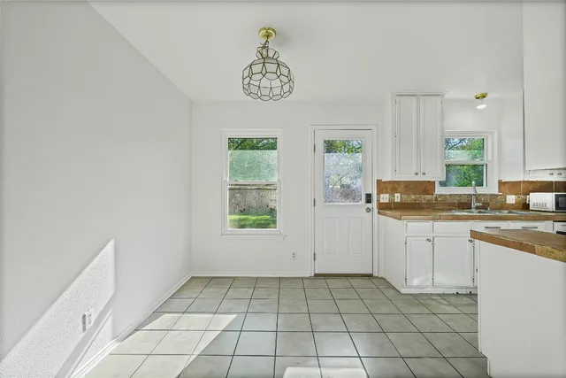 a kitchen with a cabinets and window