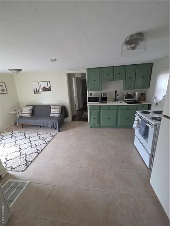 a kitchen with stainless steel appliances granite countertop a sink and cabinets