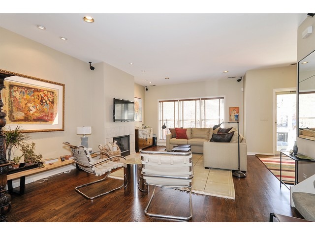 1336 West Fillmore Street Chicago, IL 60607 - Photo 3 of 20 a living room with fireplace furniture and wooden floor