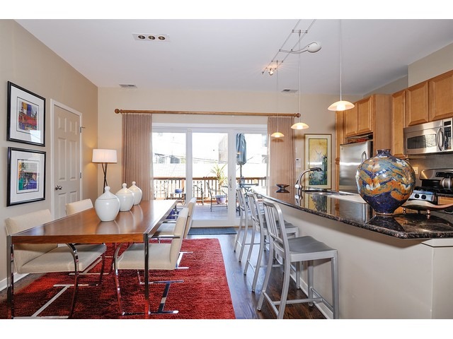 1336 West Fillmore Street Chicago, IL 60607 - Photo 5 of 20 a view of a dining room with furniture and a chandelier