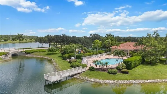 an aerial view of residential houses with outdoor space and swimming pool