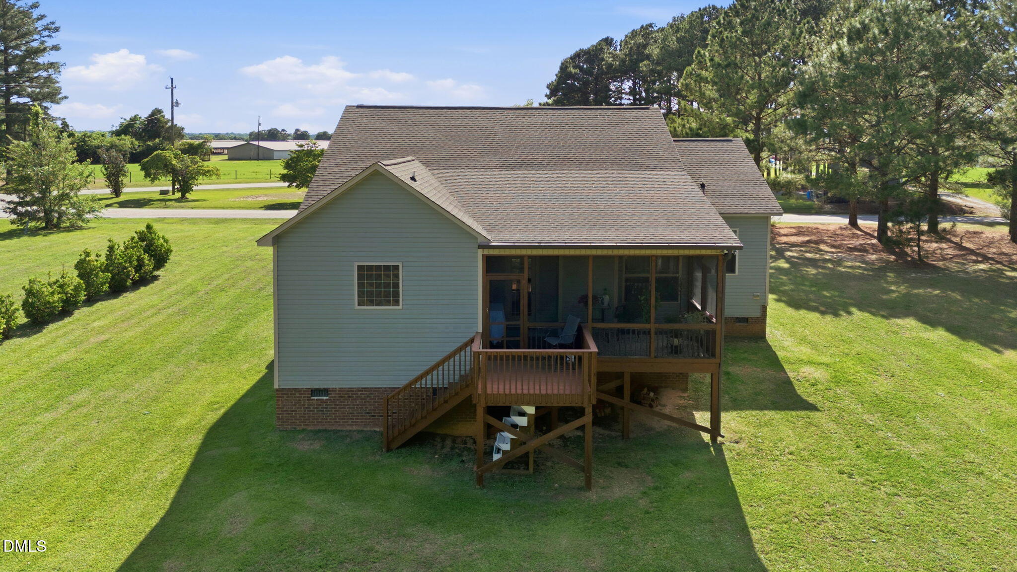 1547 Lassiter Pond Road Four Oaks, NC 27524 - Photo 41 of 45 a backyard of a house with table and chairs