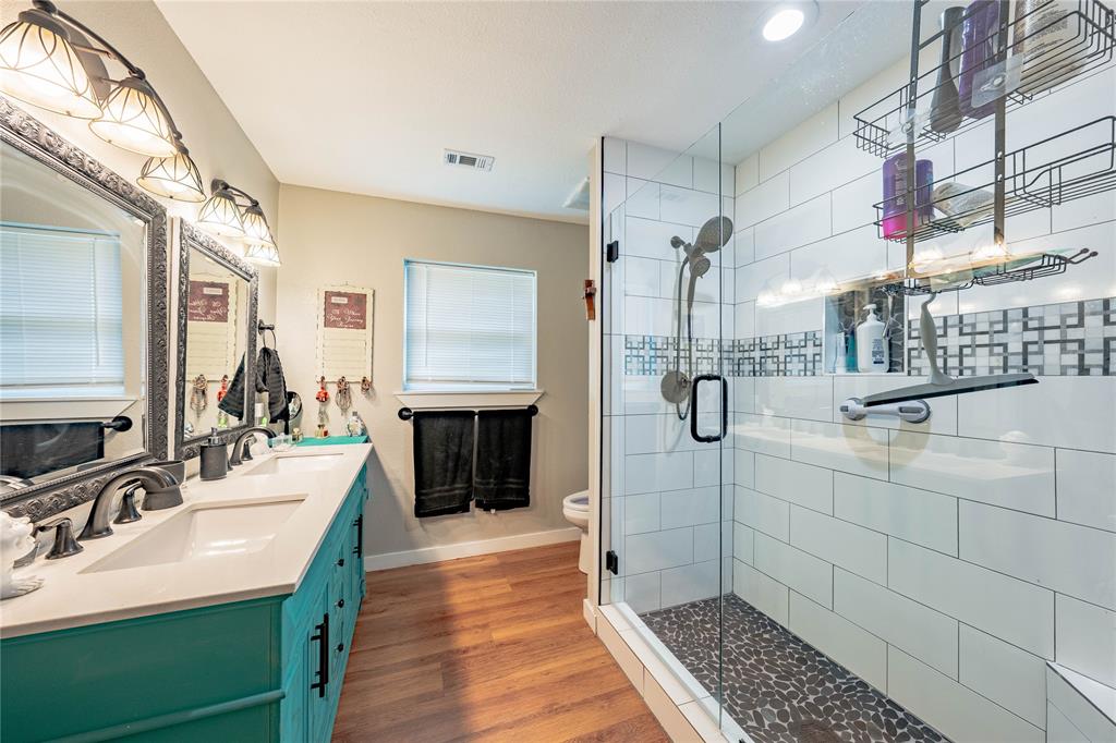 603 Mosley Road Athens, TX 75751 - Photo 13 of 14 a bathroom with a sink double vanity and a shower