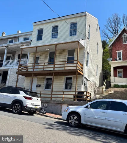 a car parked in front of a house