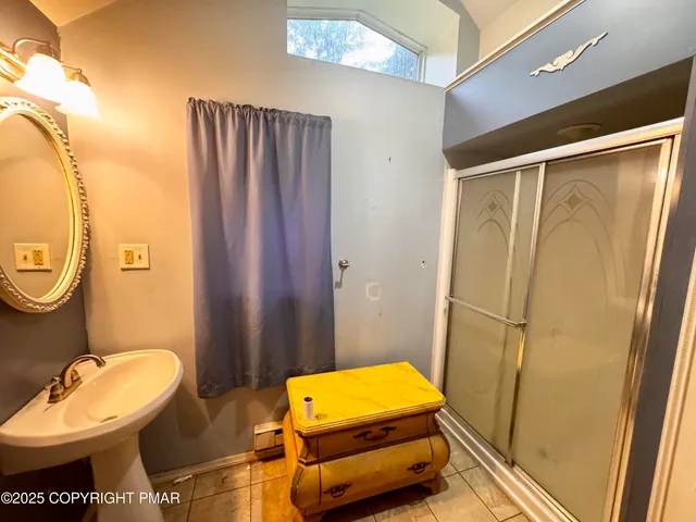 a bathroom with a sink mirror vanity and toilet