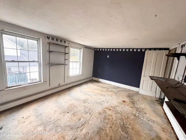 an empty room with windows