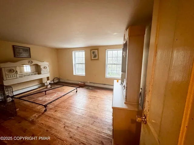 a room with gym equipment and windows