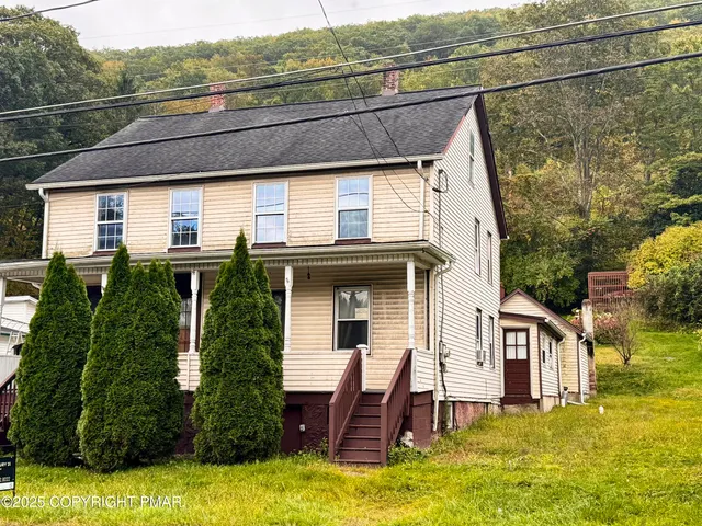 a view of a house with a swimming pool