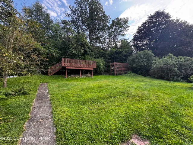 a view of a backyard with a small cabin