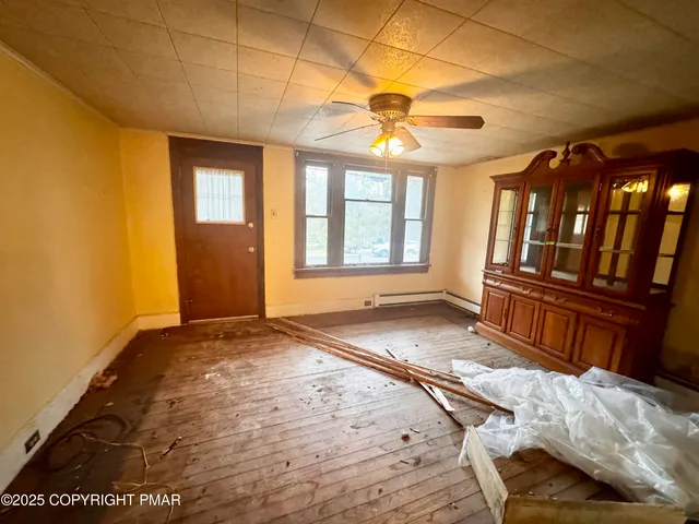 a view of an empty room with a window