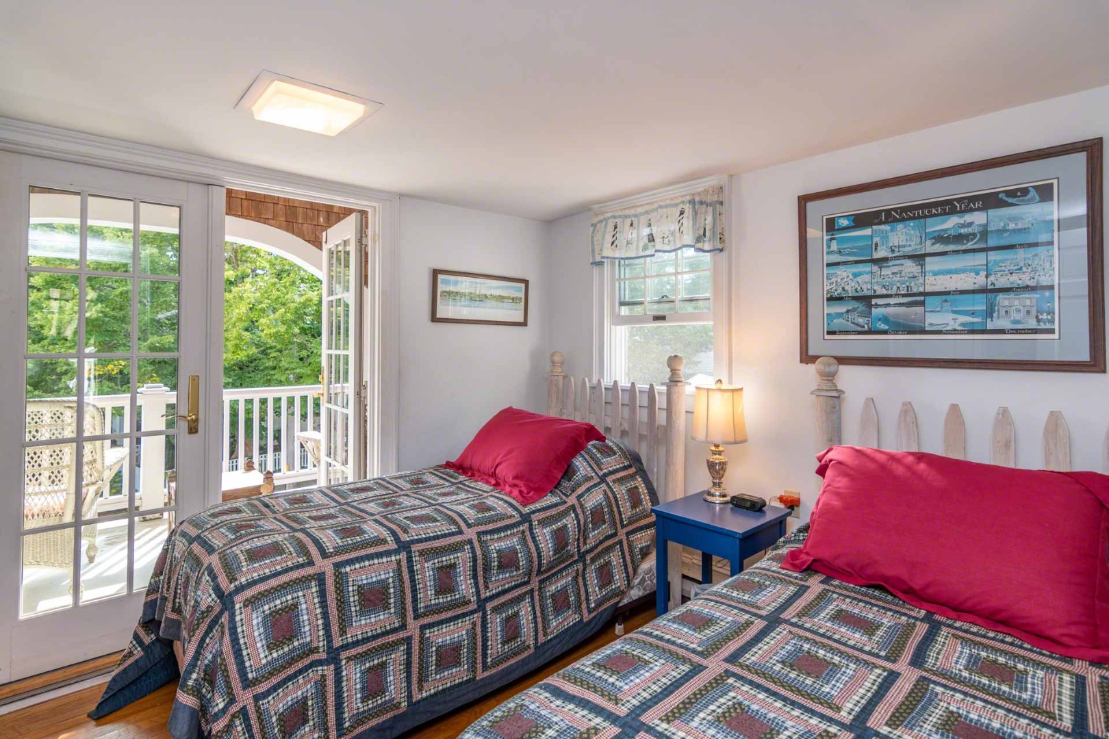 25 High Street Edgartown, MA 02539 - Photo 22 of 26 a bedroom with a bed and wooden floor