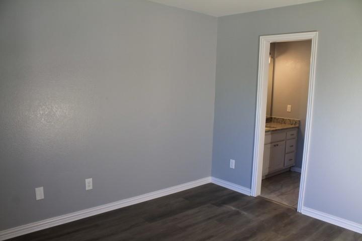 3051 Plainview Road Midlothian, TX 76065 - Photo 17 of 19 a view of an empty room with closet and wooden floor