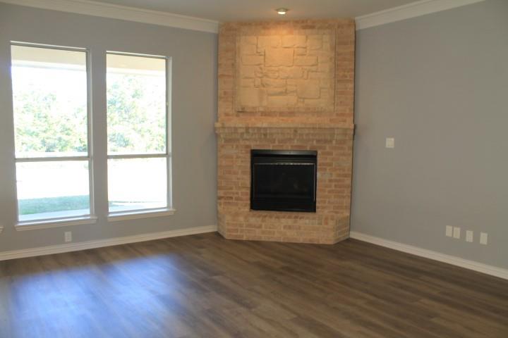 3051 Plainview Road Midlothian, TX 76065 - Photo 10 of 19 a view of an empty room with wooden floor and a window