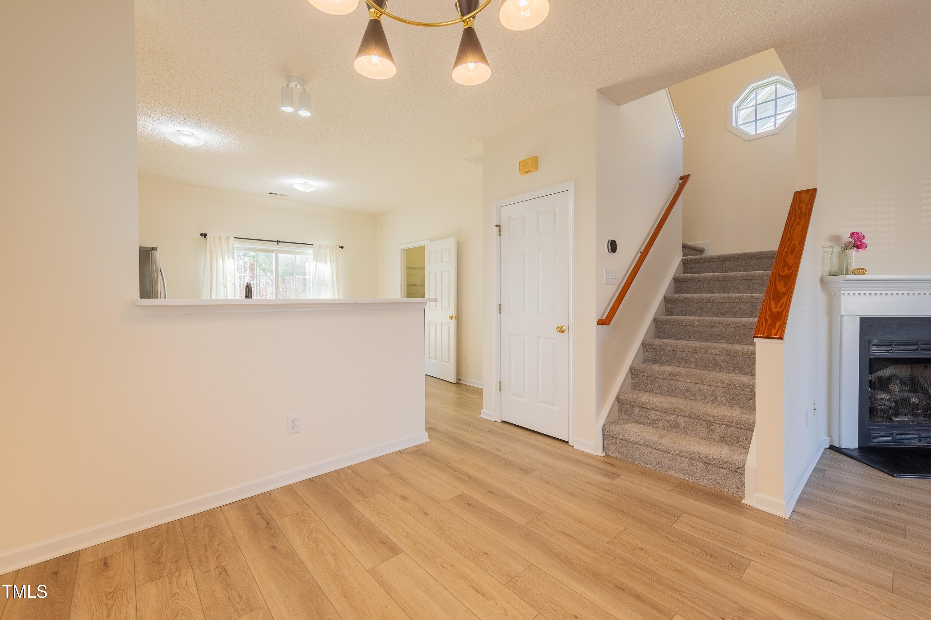 10809 Farmville Road Raleigh, NC 27614 - Photo 10 of 28 a view of a room with wooden floor and staircase