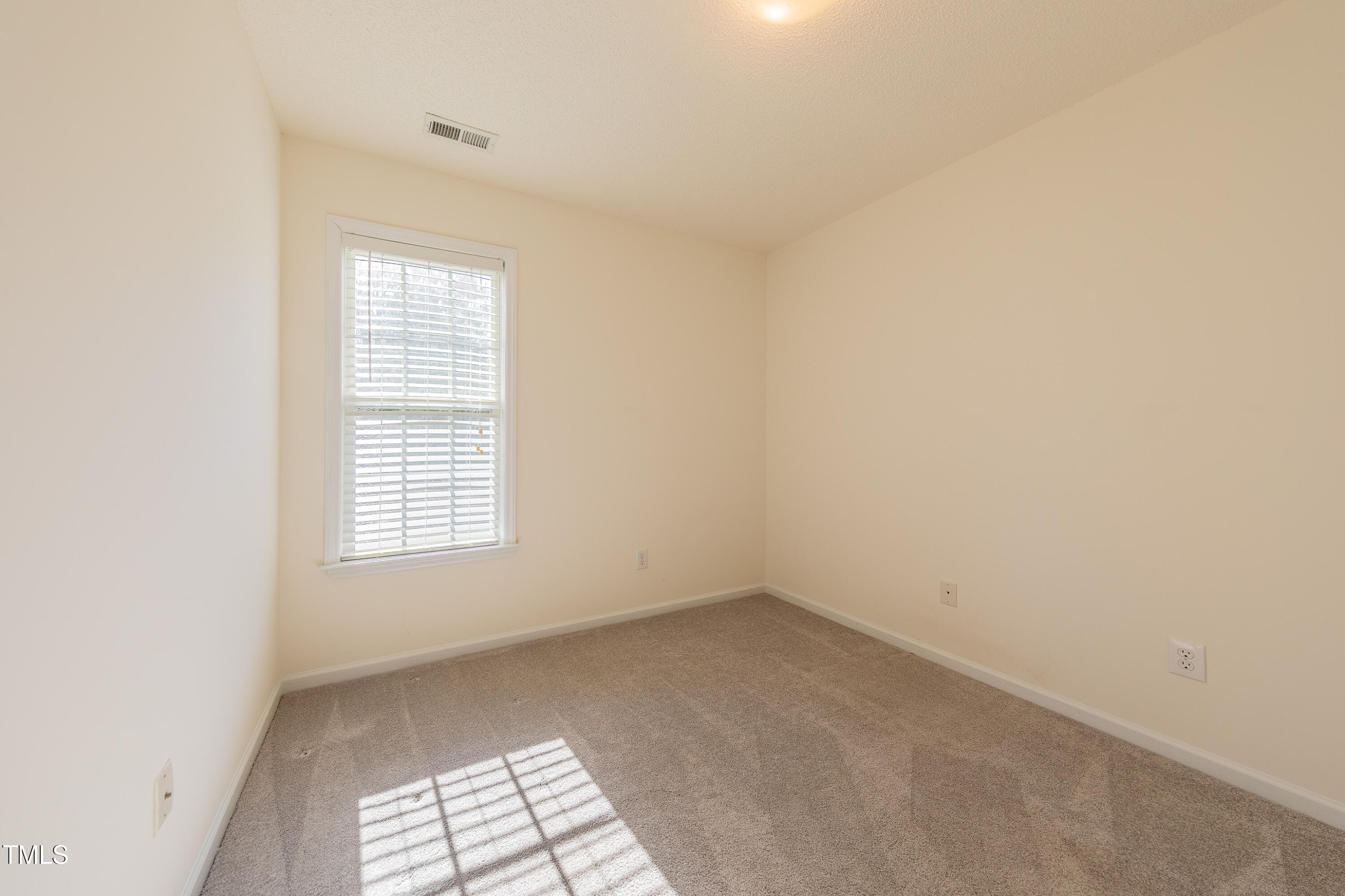 10809 Farmville Road Raleigh, NC 27614 - Photo 22 of 28 an empty room with a window