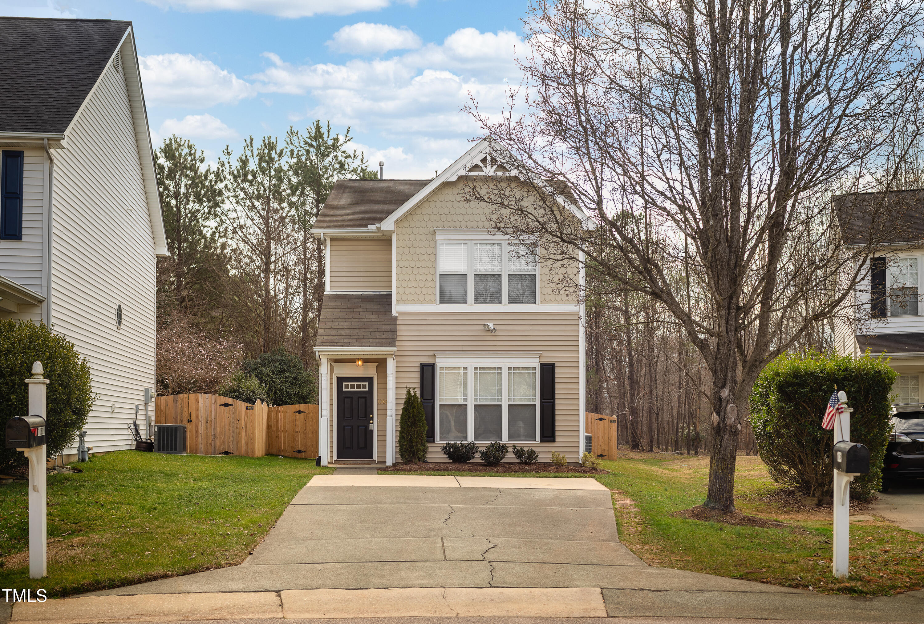 10809 Farmville Road Raleigh, NC 27614 - Photo 2 of 28 a front view of a house with garden