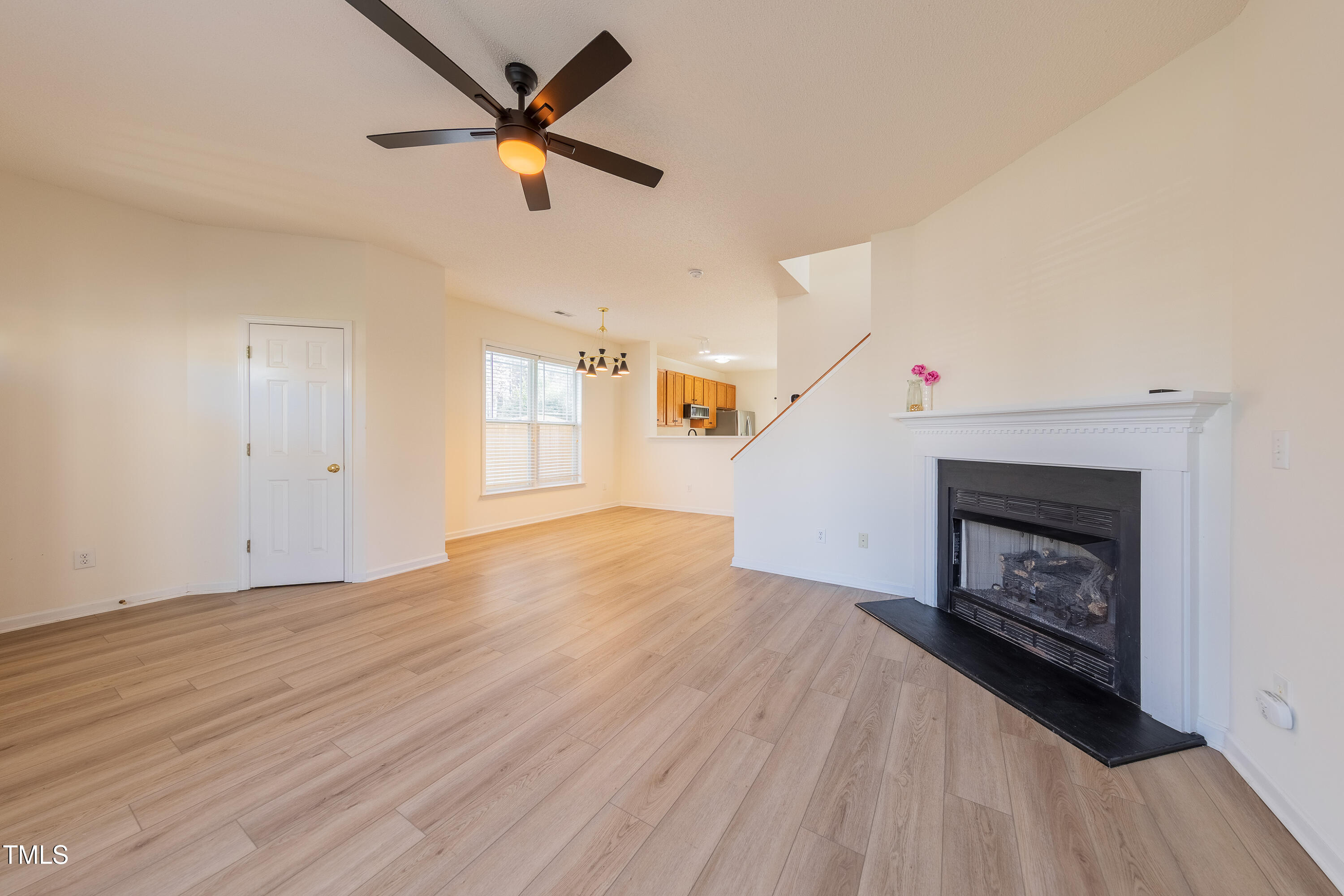 10809 Farmville Road Raleigh, NC 27614 - Photo 7 of 28 an empty room with windows and fireplace