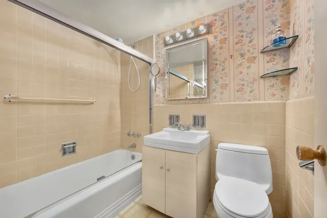 a bathroom with a toilet a sink and a bathtub
