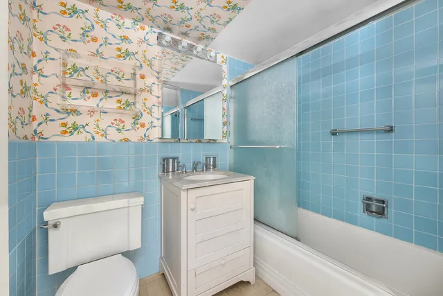 a bathroom with a toilet a sink and bathtub