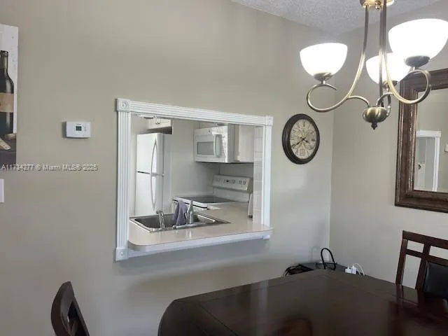 a room with a table and a mirror