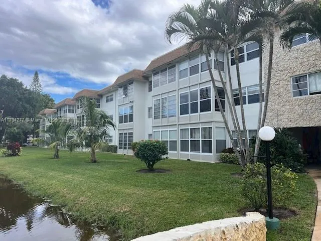 a view of a lake with a building in the background