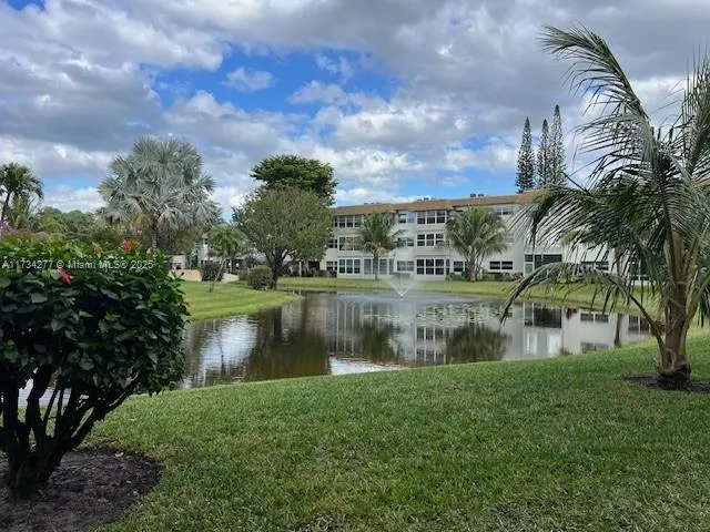 a view of a patio with a table chairs and a patio