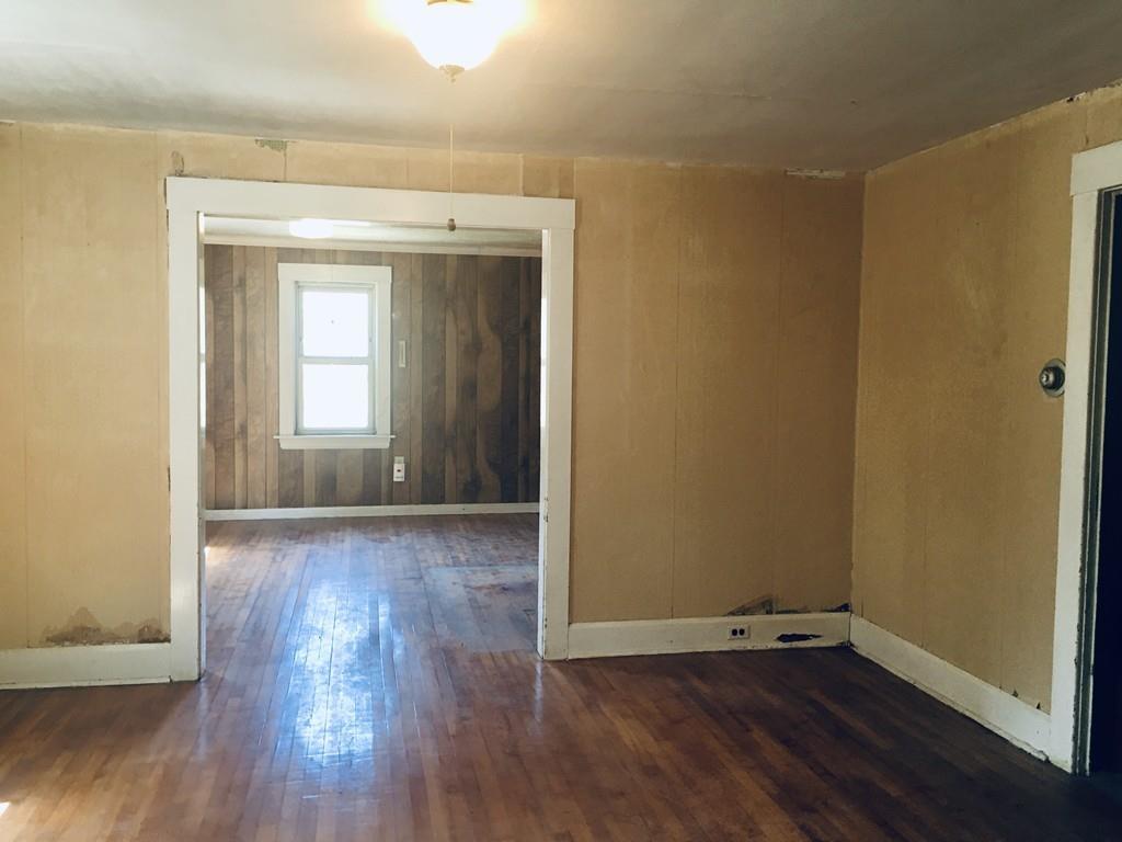 63 Gardner Road Hubbardston, MA 01452 - Photo 14 of 42 an empty room with wooden floor and windows