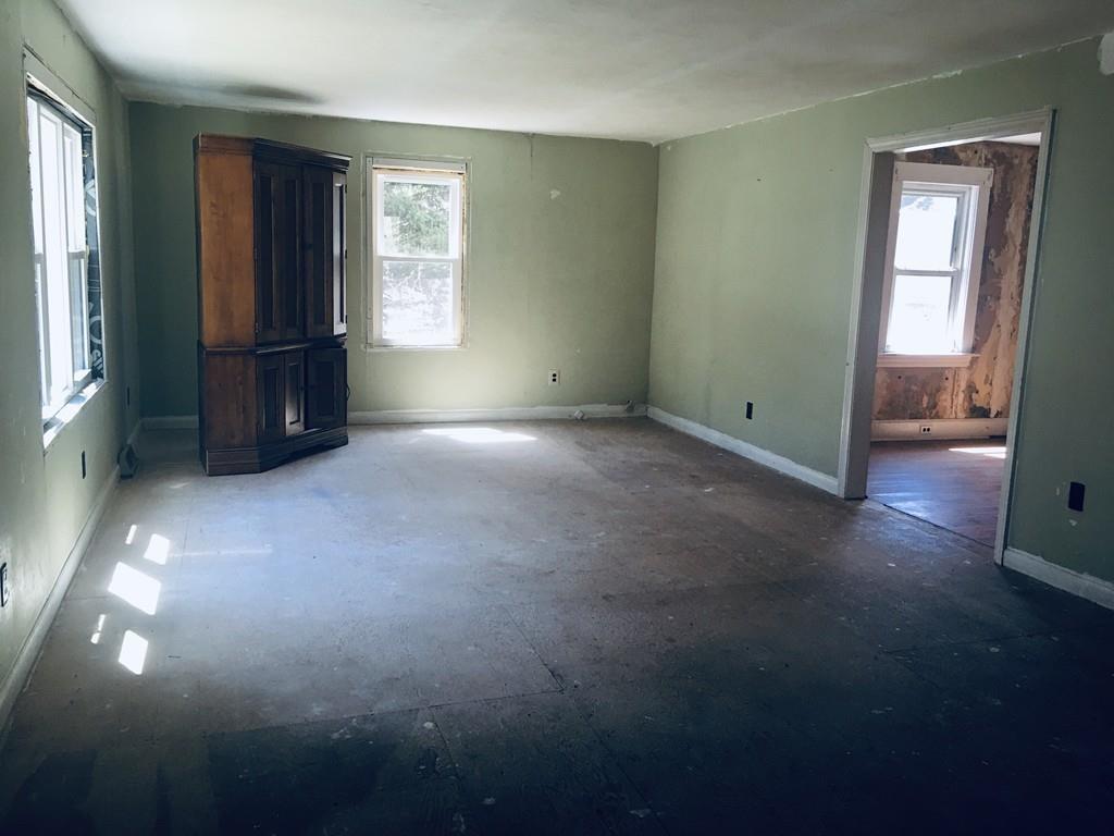 63 Gardner Road Hubbardston, MA 01452 - Photo 15 of 42 an empty room with windows and closet