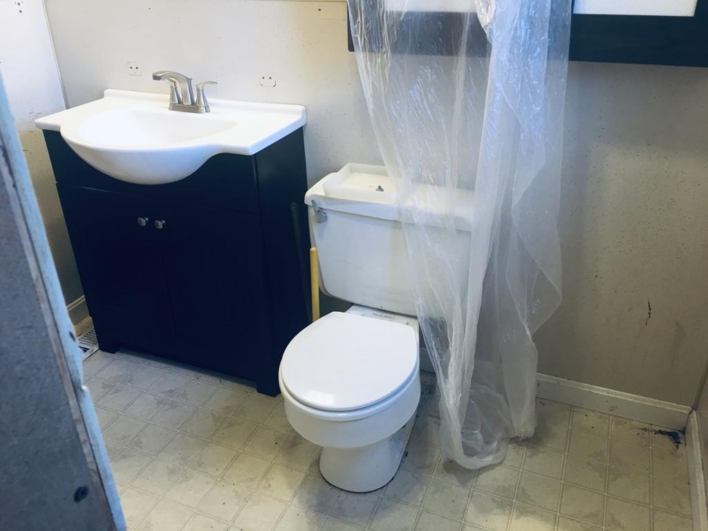 63 Gardner Road Hubbardston, MA 01452 - Photo 16 of 42 a bathroom with a sink toilet and a mirror