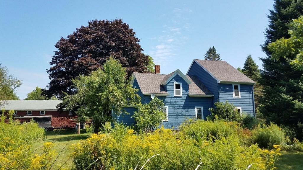 63 Gardner Road Hubbardston, MA 01452 - Photo 3 of 42 a aerial view of a house with a yard and potted plants
