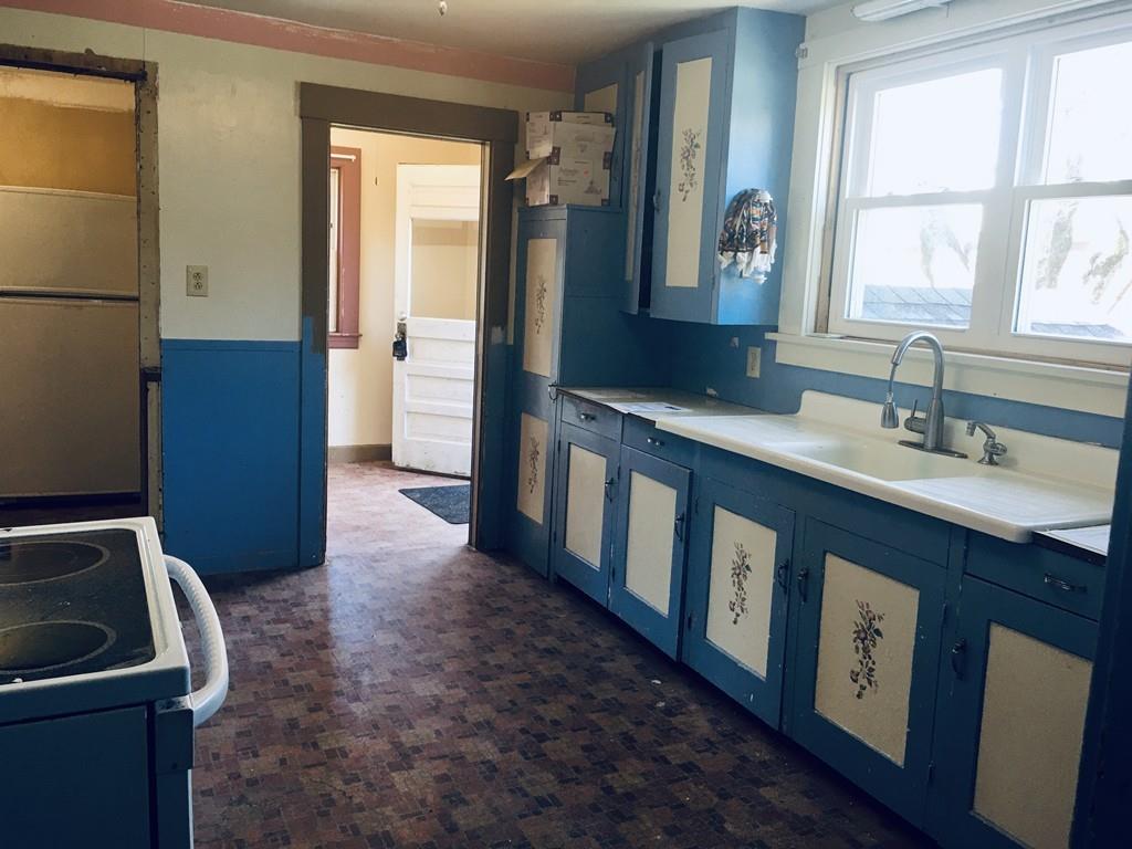 63 Gardner Road Hubbardston, MA 01452 - Photo 8 of 42 a kitchen with a sink a stove and a refrigerator