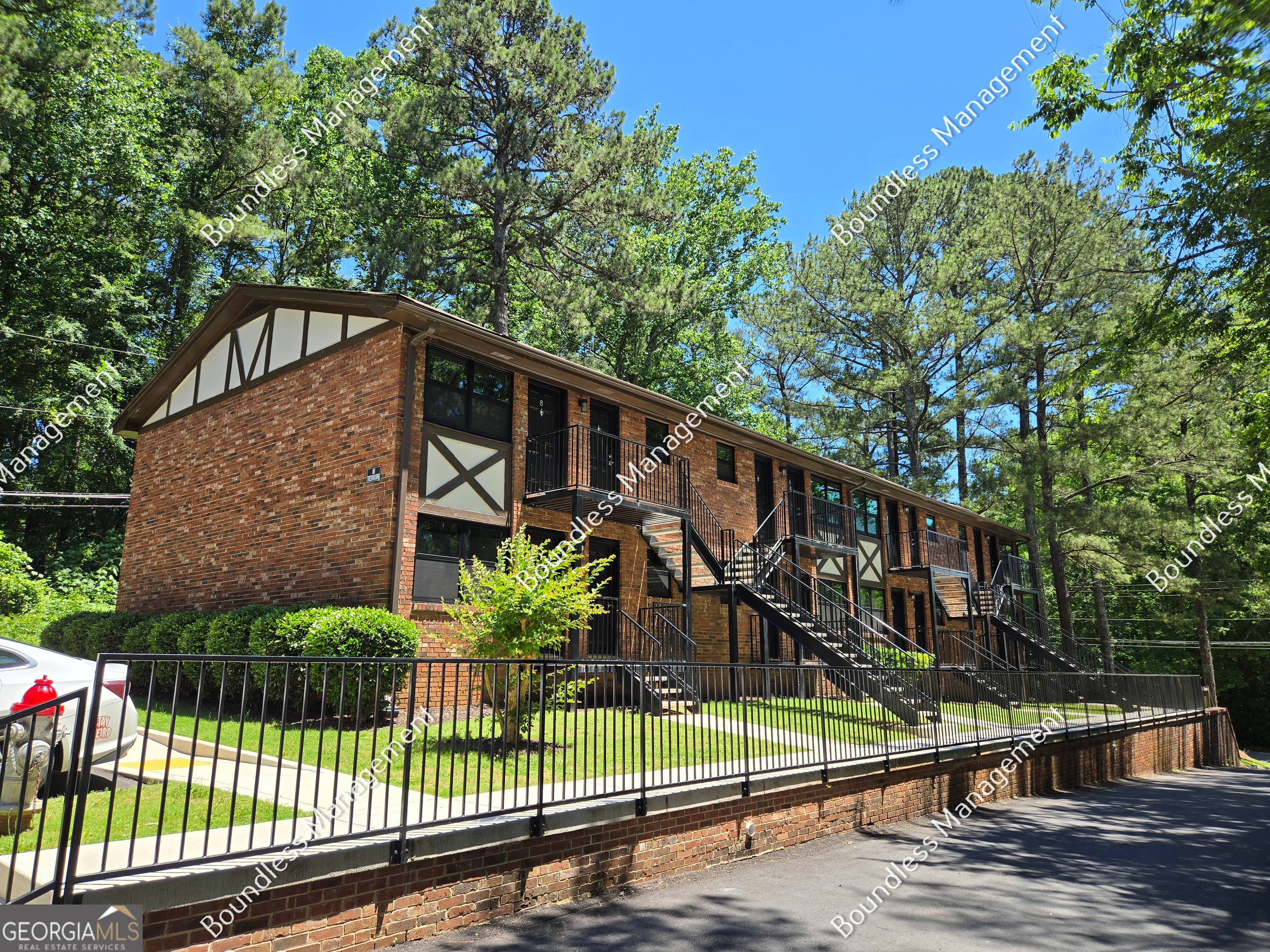 a view of a house with a small yard next to a house