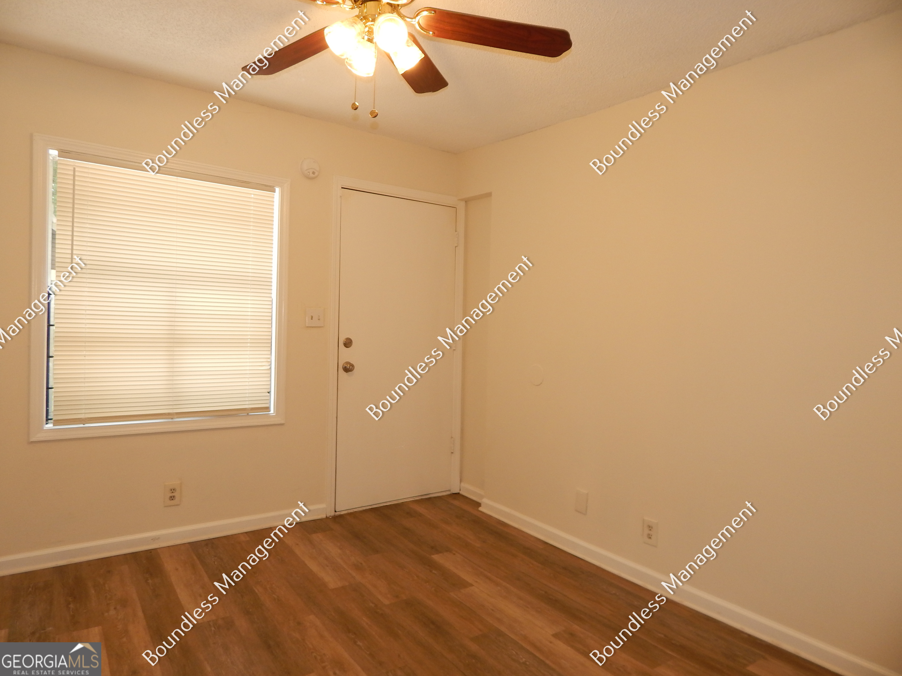 3627 Forrest Park Road Southeast, Unit 25 Atlanta, GA 30354 - Photo 3 of 13 a view of an empty room with a window