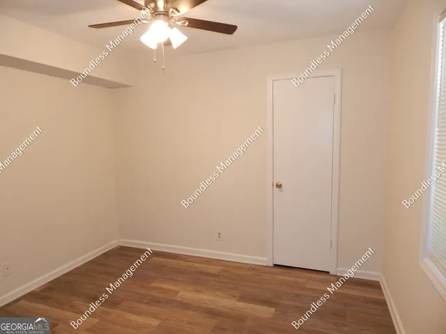 a view of entryway with wooden floor
