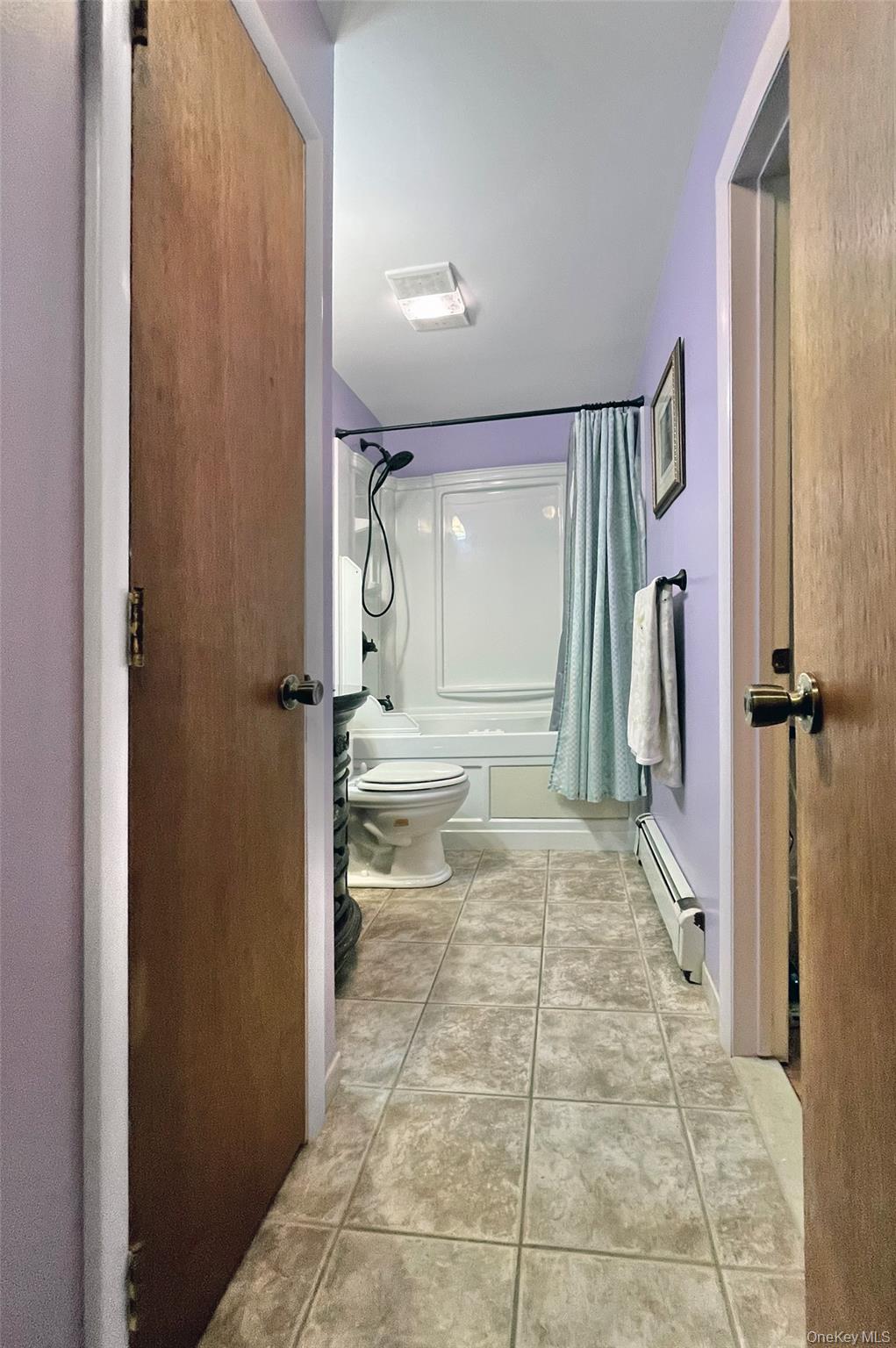 554 High Street Monroe, NY 10950 - Photo 25 of 29 a bathroom with a granite countertop sink a toilet and a shower