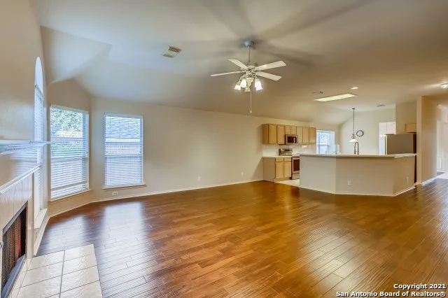 a view of a kitchen with kitchen wooden floor and a kitchen