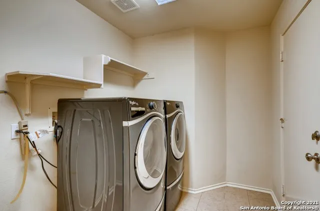 a utility room with dryer and washer