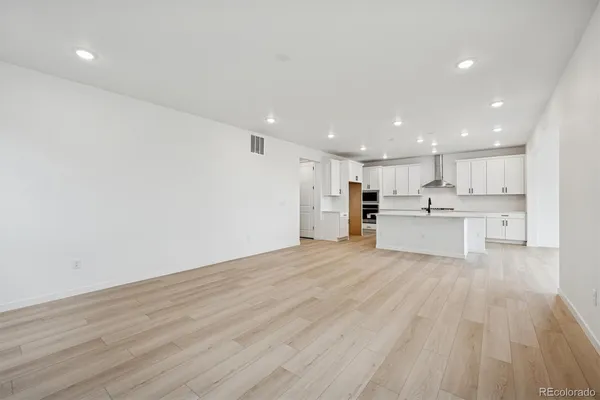 a view of kitchen with wooden floor