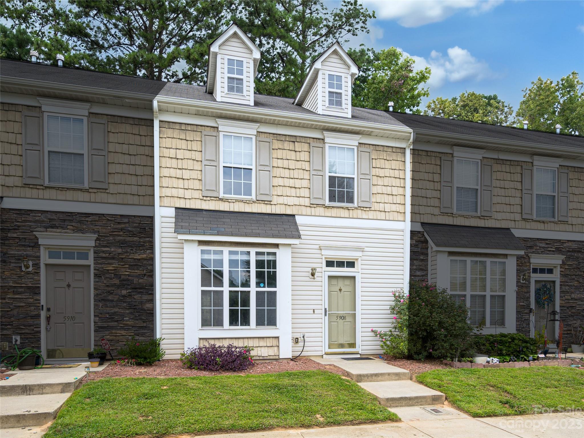 front view of a house with a yard
