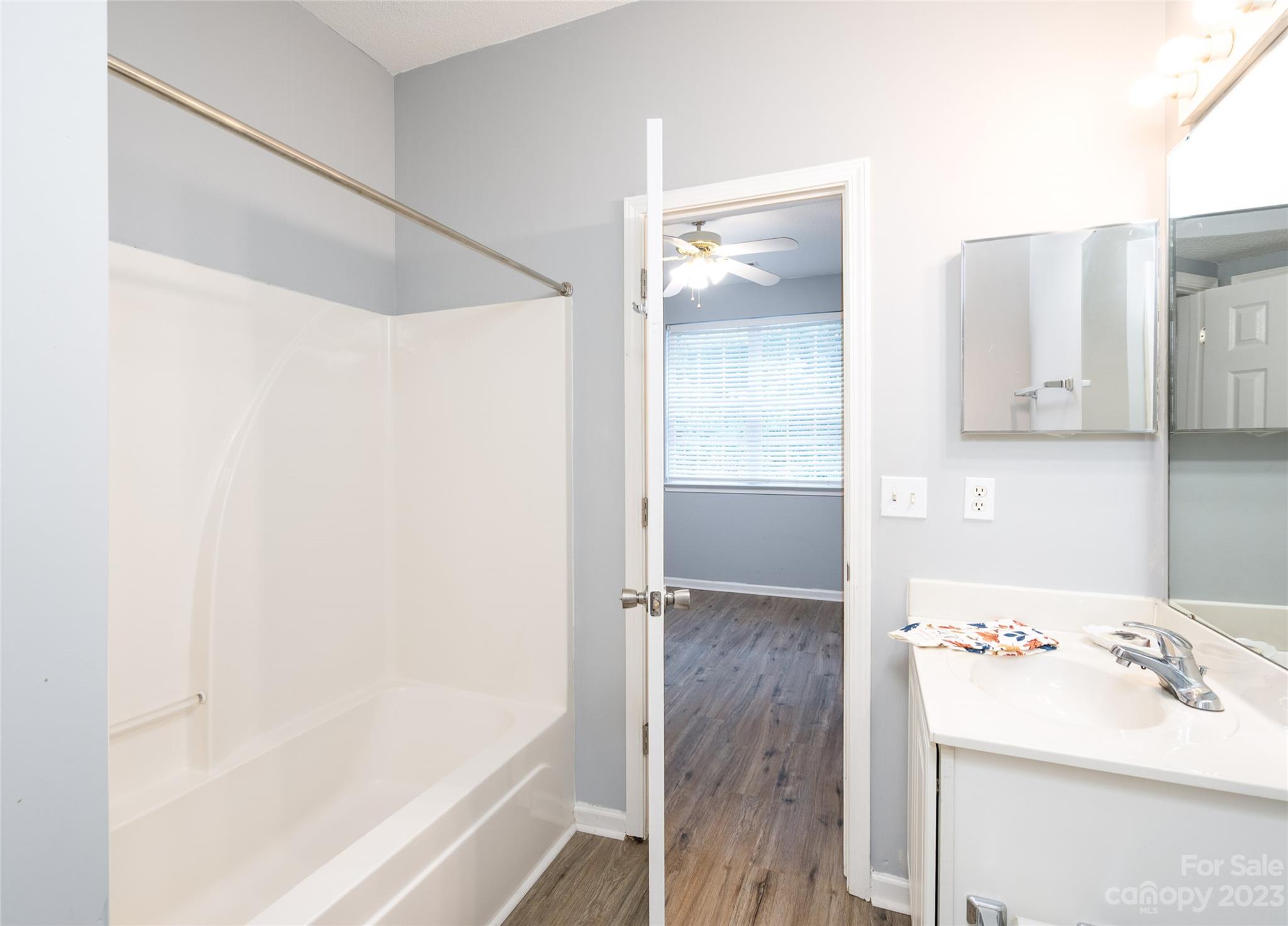 5908 Britt Lane Dallas, NC 28034 - Photo 11 of 22 a bathroom with a bathtub and a sink