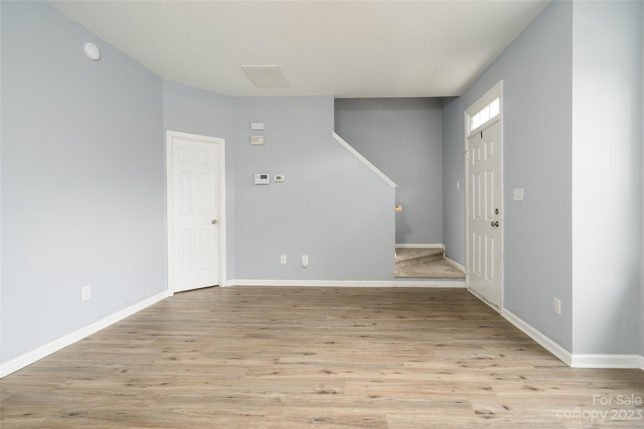 5908 Britt Lane Dallas, NC 28034 - Photo 14 of 22 a view of an empty room with wooden floor