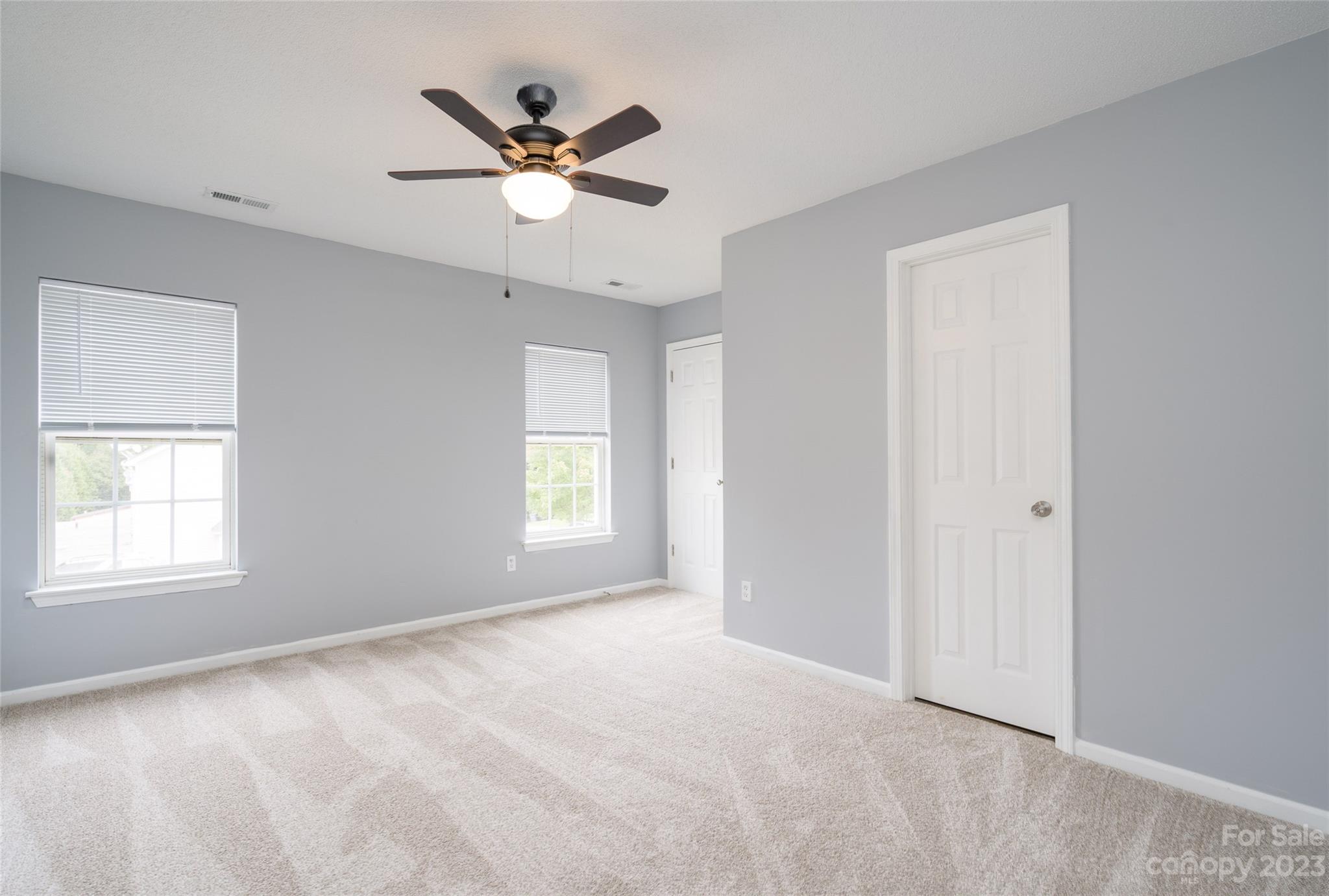 5908 Britt Lane Dallas, NC 28034 - Photo 17 of 22 a view of a livingroom with a window and a ceiling fan