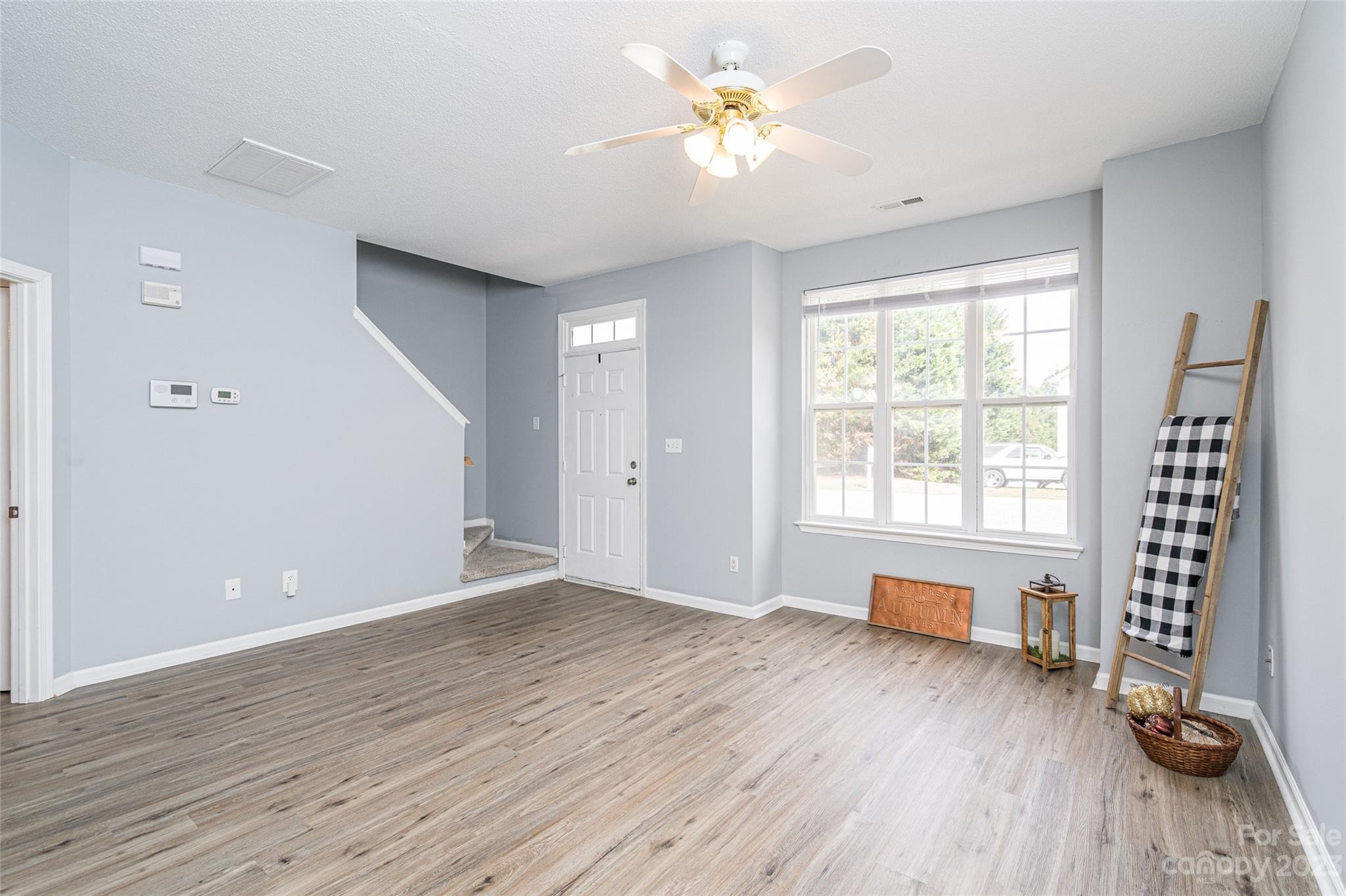 5908 Britt Lane Dallas, NC 28034 - Photo 2 of 22 a view of an empty room with a window and wooden floor