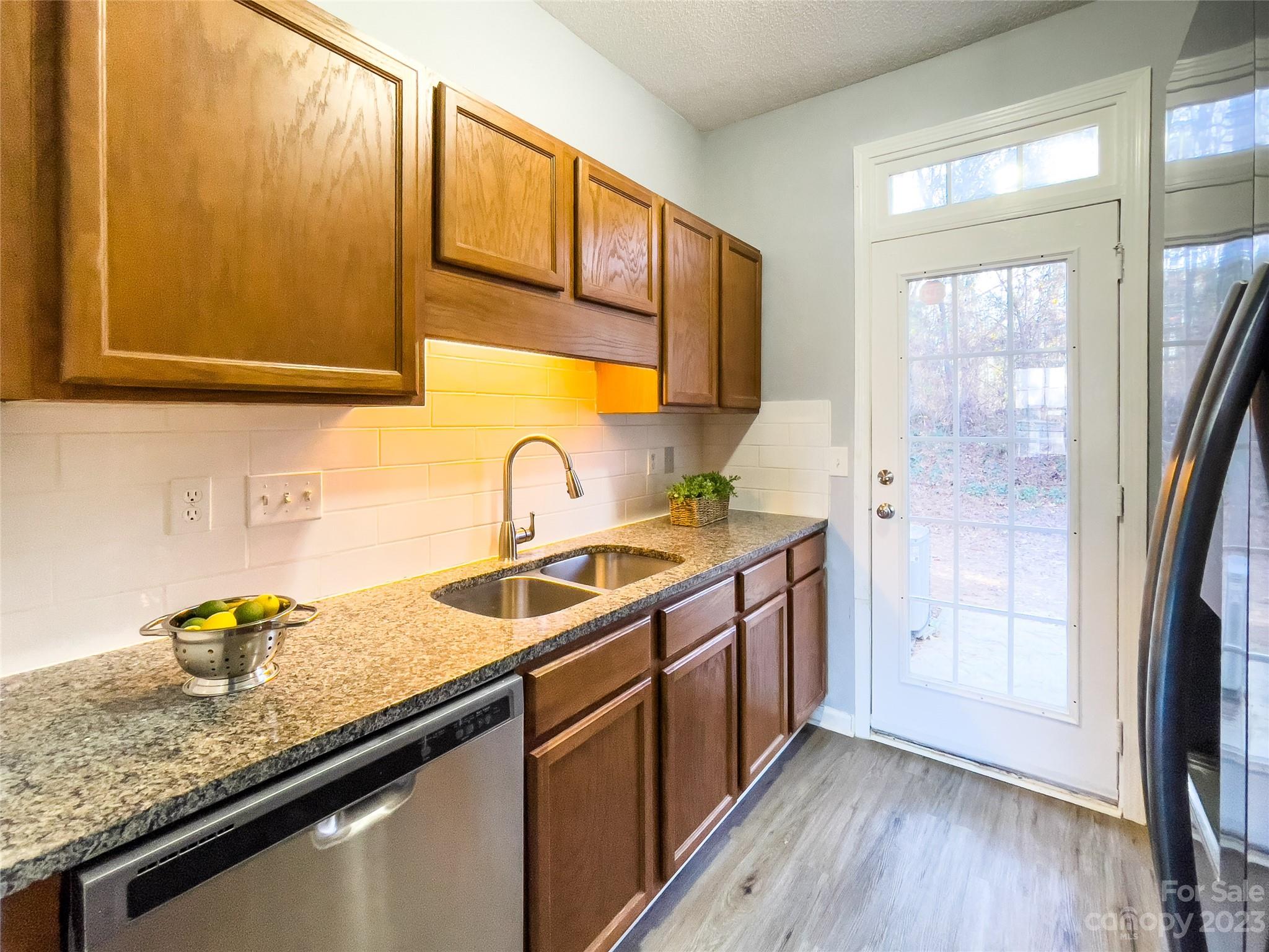 5908 Britt Lane Dallas, NC 28034 - Photo 8 of 22 a kitchen with stainless steel appliances granite countertop a sink a stove and a refrigerator