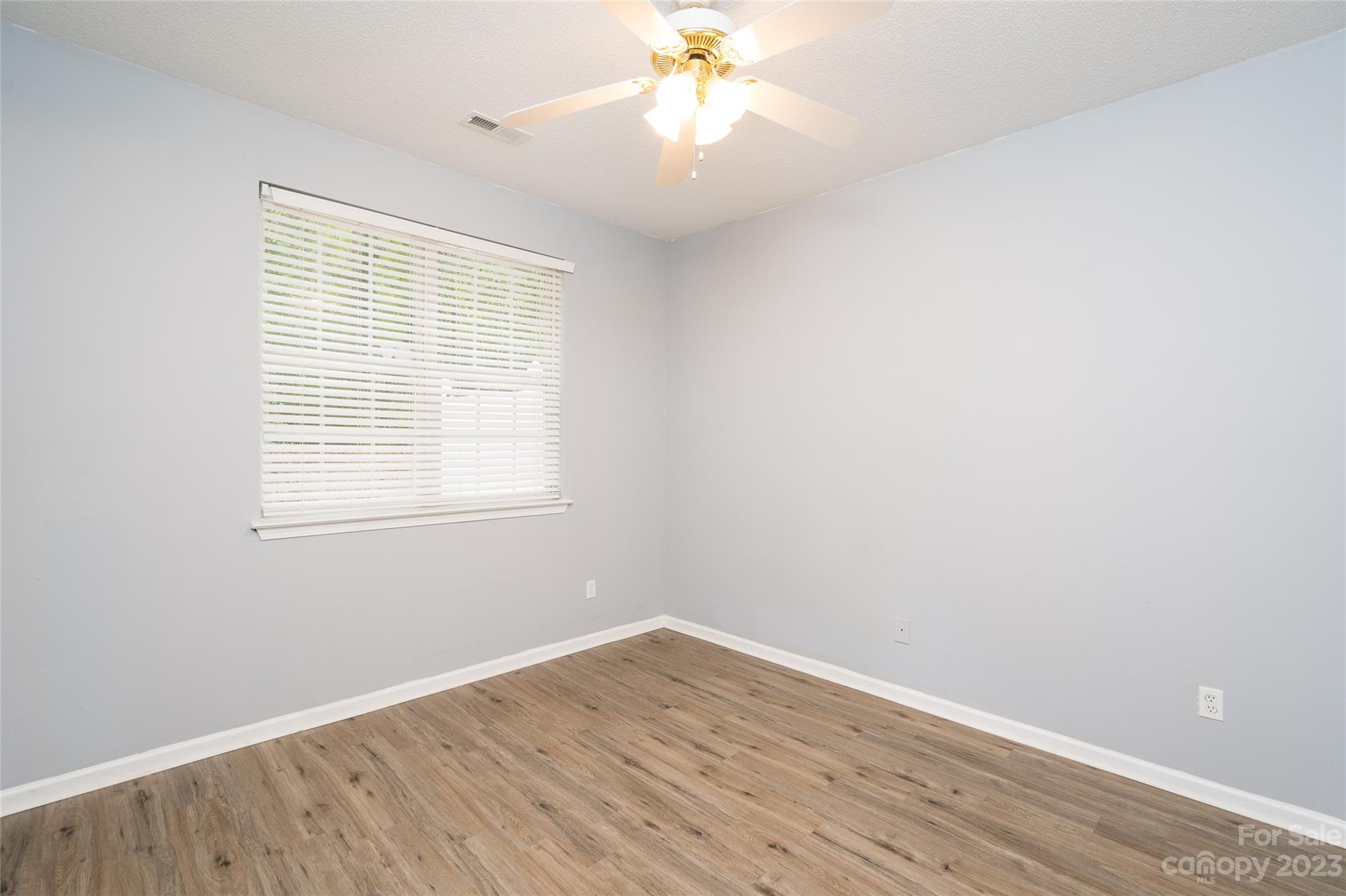 5908 Britt Lane Dallas, NC 28034 - Photo 9 of 22 wooden floor in an empty room with a window